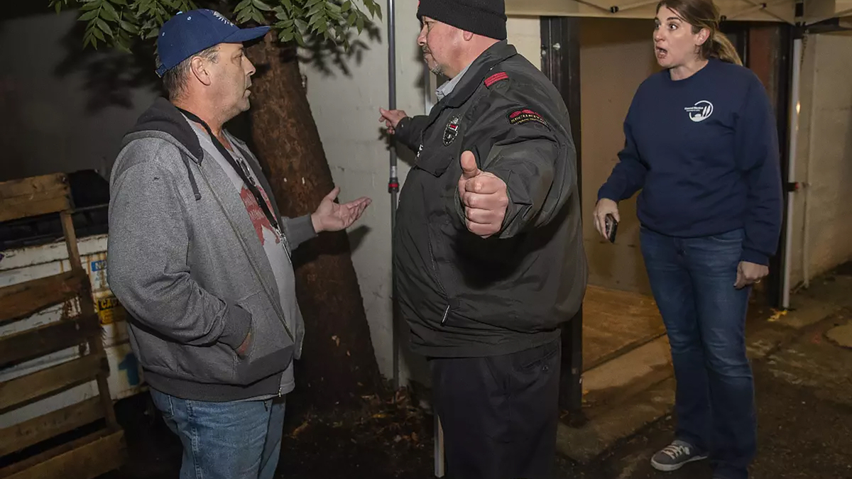 Richard Gallardo, a leader of the citizens’ group that wrote Shasta County’s Measure B, is blocked by a guard in November 2022 after attempting to go into a restricted area to observe ballots at the elections office in Redding. At right is then-assistant county registrar Joanna Francescut, who was elected this month to be the next registrar. (Mel Melcon/Los Angeles Times/TNS)
