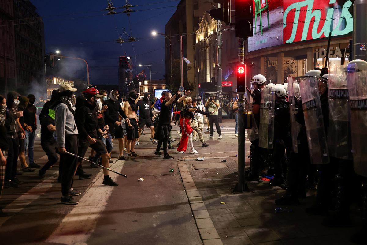 Demonstrators stand in front of riot police, during a student-led protest demanding snap parliamentary elections, as Serbia's anti-corruption movement enters a new phase, following the Novi Sad railway station canopy collapse that killed 16 people in 2024, in Belgrade, Serbia, May 23, 2026. REUTERS/Zorana Jevtic
