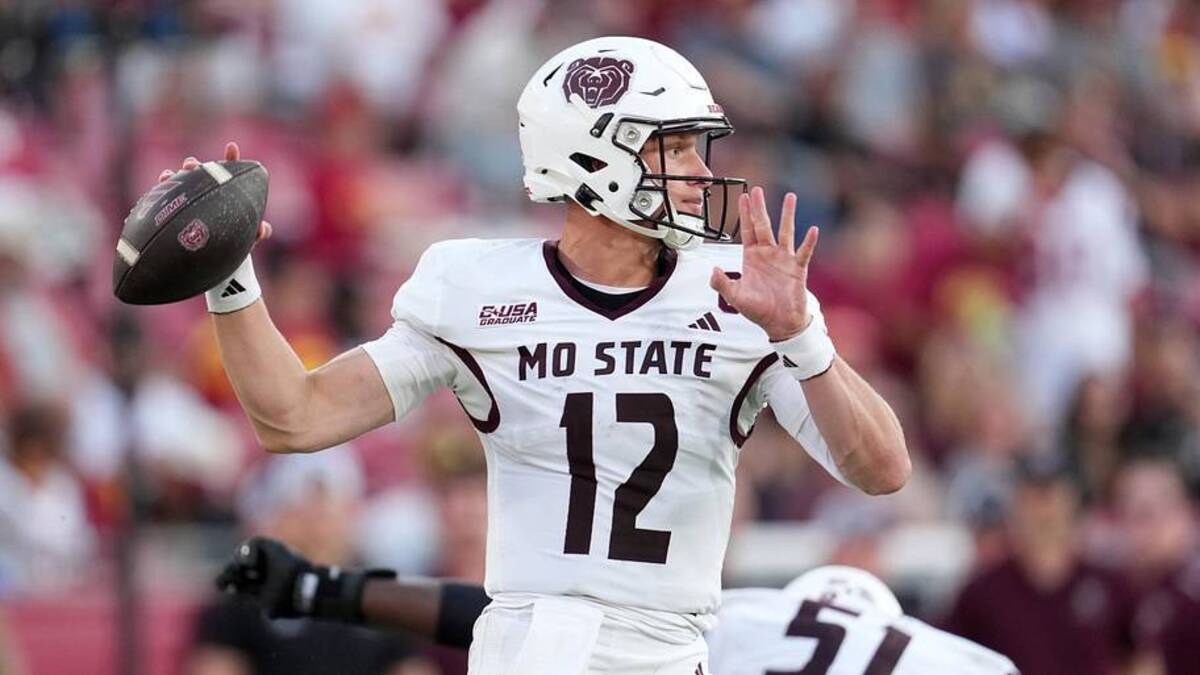  Aug 30, 2025; Los Angeles, California, USA; Missouri State Bears quarterback Jacob Clark (12) throws the ball against the Southern California Trojans in the second half at United Airlines Field at Los Angeles Memorial Coliseum. Mandatory Credit: Kirby Lee-Imagn Images | Kirby Lee-Imagn Images 