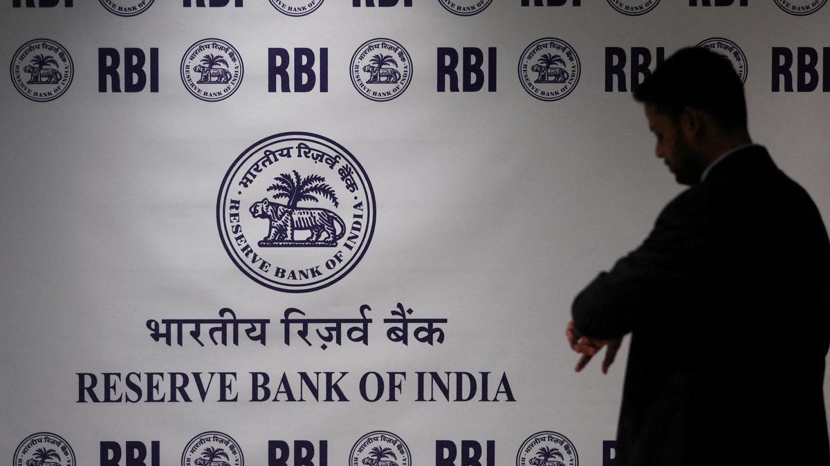 FILE PHOTO: man stands in front of the Reserve Bank of India (RBI) logo inside its headquarters in Mumbai, India, February 6, 2026. REUTERS/Francis Mascarenhas//File Photo