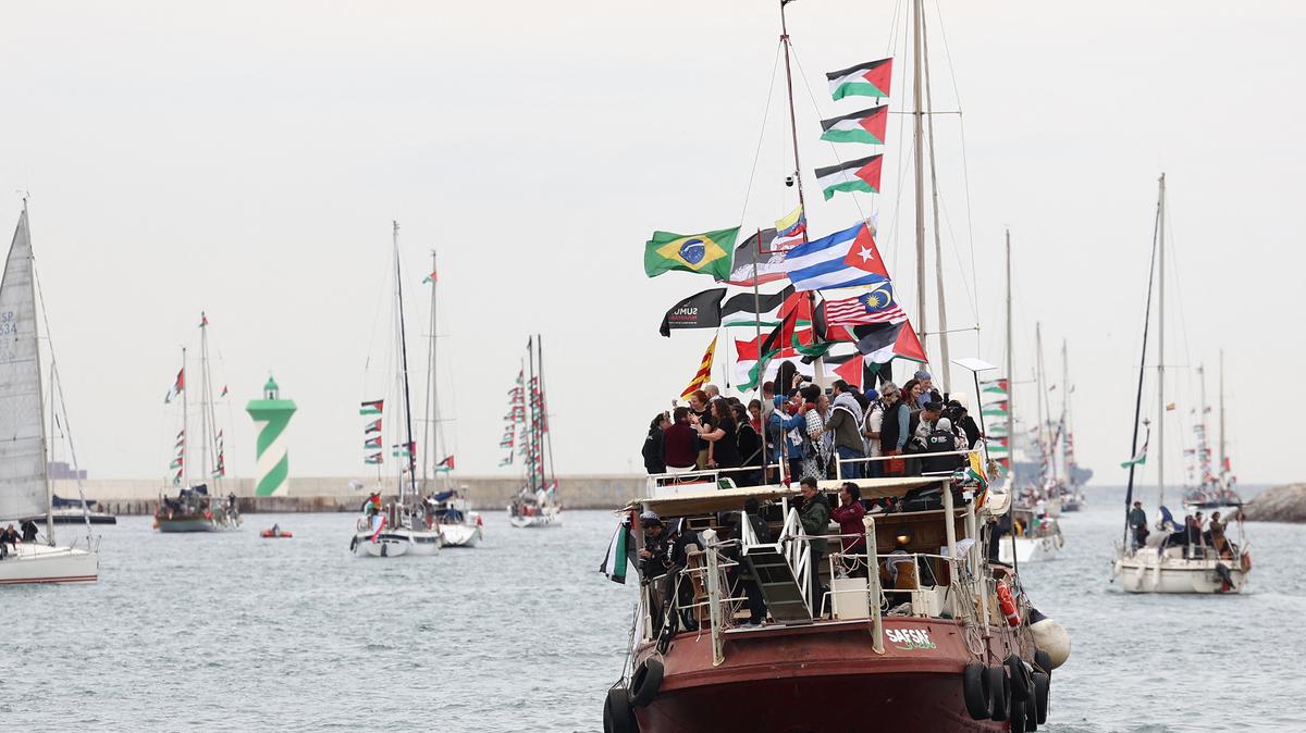 Boats of a new humanitarian flotilla bound for the Gaza Strip make a symbolic leave from Barcelona's Port Vell on April 12, 2026, as the departure of the flotilla has been postponed due to bad weather. (Josep Lago/AFP/Getty Images/TNS)