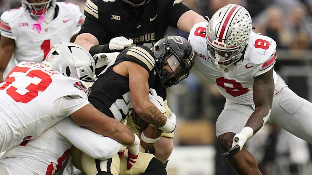  Ohio State Buckeyes defensive tackle Will Smith Jr. (53) and linebacker Arvell Reese (8) bring down Purdue Boilermakers running back Antonio Harris (22) during the NCAA football game at Ross-Ade Stadium in West Lafayette, Ind. on Nov. 8, 2025. Ohio State won 34-10. | Adam Cairns/Columbus Dispatch / USA TODAY NETWORK via Imagn Images 