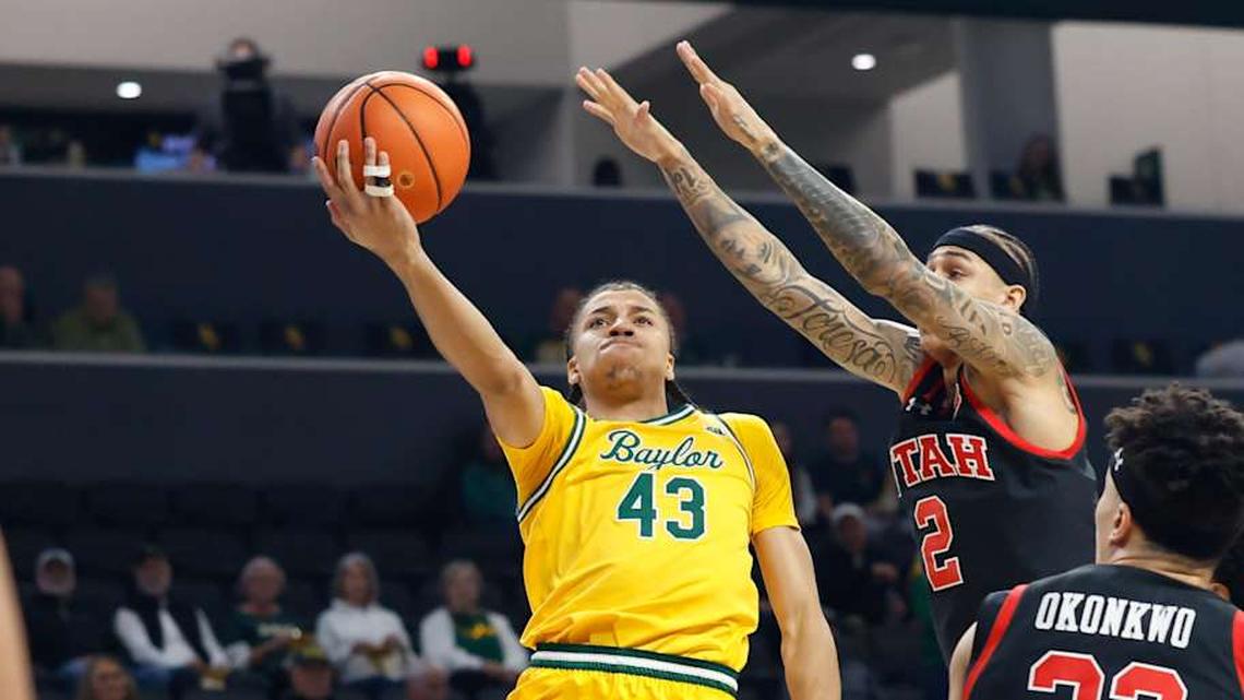  Mar 7, 2026; Waco, Texas, USA; Baylor Bears guard Cameron Carr (43) scores a layup as Utah Utes guard Terrence Brown (2) defends during the first half at Paul and Alejandra Foster Pavilion. Mandatory Credit: Chris Jones-Imagn Images | Chris Jones-Imagn Images 