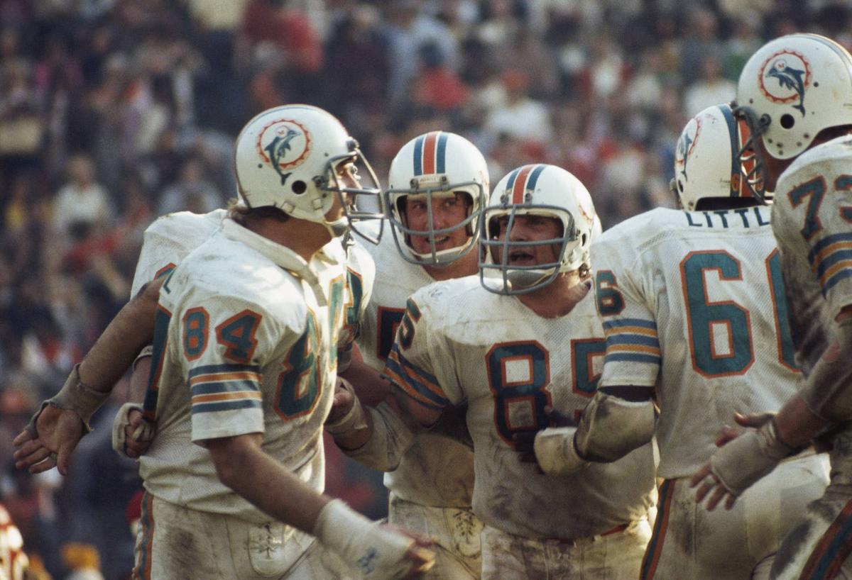  LOS ANGELES - JANUARY 14: Linebacker Nick Buoniconti #85 (C) pumps up teammates (L-R) Bill Stanfill #84, Mike Kolen #57 and Larry Little #66 of the Miami Dolphins defensive line during Super Bowl VIII against the Washington Redskins at Memorial Coliseum in Los Angeles, California on January 14, 1973. The Dolphins defeated the Redskins 14-7. (Photo by Focus On Sport/Getty Images) 