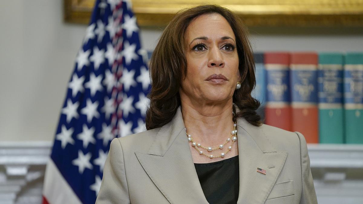 Vice President Kamala Harris listens as President Joe Biden speaks about abortion access during an event in the Roosevelt Room of the White House, Friday, July 8, 2022, in Washington.
