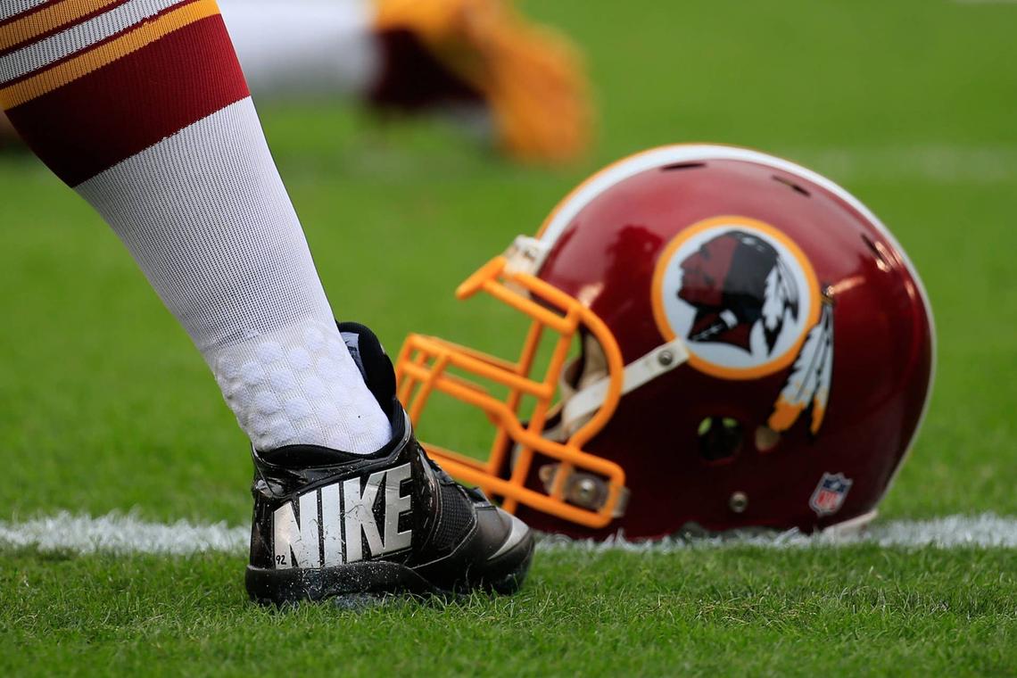  PHILADELPHIA, PA - SEPTEMBER 21: A Washington Redskins Nike cleat and helmet is seen on the field before the game against the Philadelphia Eagles at Lincoln Financial Field on September 21, 2014 in Philadelphia, Pennsylvania. (Photo by Rob Carr/Getty Images) 