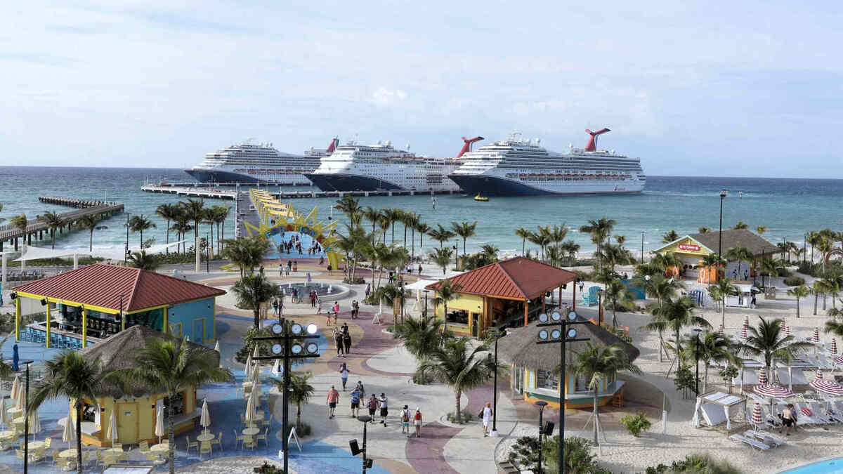 Three ships docked at Carnival's Celebration Key in The Bahamas. 