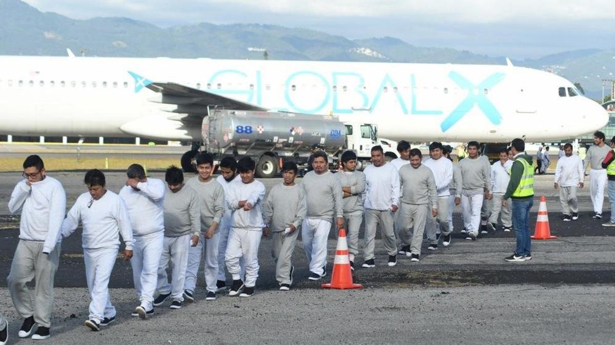 Migrants from their plane at the Guatemalan Air Force base after arriving on the last deportation flight of the year from the United States, in Guatemala City on Dec. 30, 2025. Paraguay has rejected nine of the first 25 migrants the United States planned to send there under a bilateral agreement, while it prepares to receive the rest of the group on Thursday.