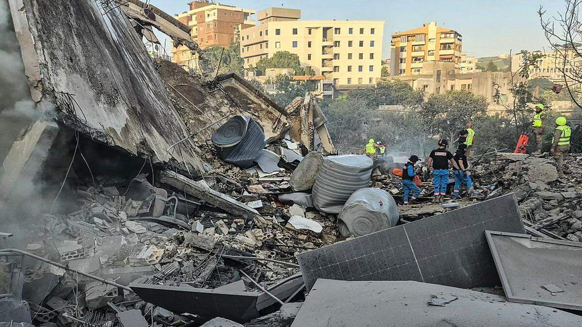 First responders search the rubble for victims at the site of an Israeli airstrike in the southern town of Nabatieh on May 9, 2026. Authorities reported eight people killed in Israeli airstrikes in southern Lebanon on May 9, with more raids targeting a highway south of Beirut outside Hezbollah's traditional strongholds and far from the centre of ongoing fighting. The fresh attacks came in spite of a three-week-old ceasefire between Israel and Iran-backed Hezbollah that has done little to halt daily exchanges of fire, mostly in south Lebanon.