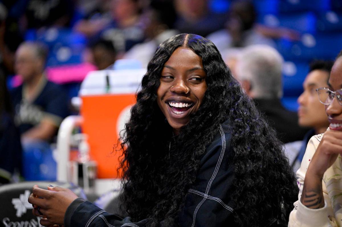  Aug 27, 2025; Arlington, Texas, USA; Dallas Wings guard Arike Ogunbowale (24) looks on from the team bench during the first half against the Connecticut Sun at College Park Center. Mandatory Credit: Jerome Miron-Imagn Images 