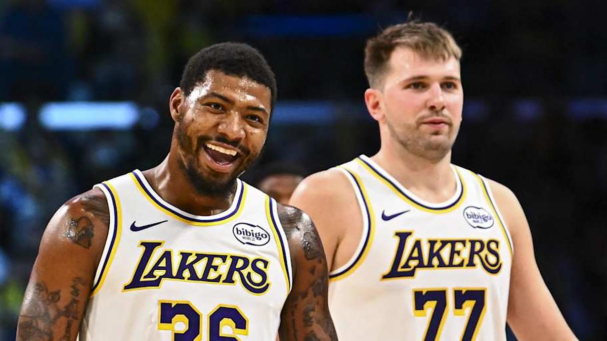  Nov 2, 2025; Los Angeles, California, USA; Los Angeles Lakers guard Marcus Smart (36) reacts with Los Angeles Lakers guard Luka Doncic (77) during a time out against the Miami Heat during the second half at Crypto.com Arena. Mandatory Credit: Jonathan Hui-Imagn Images | Jonathan Hui-Imagn Images 