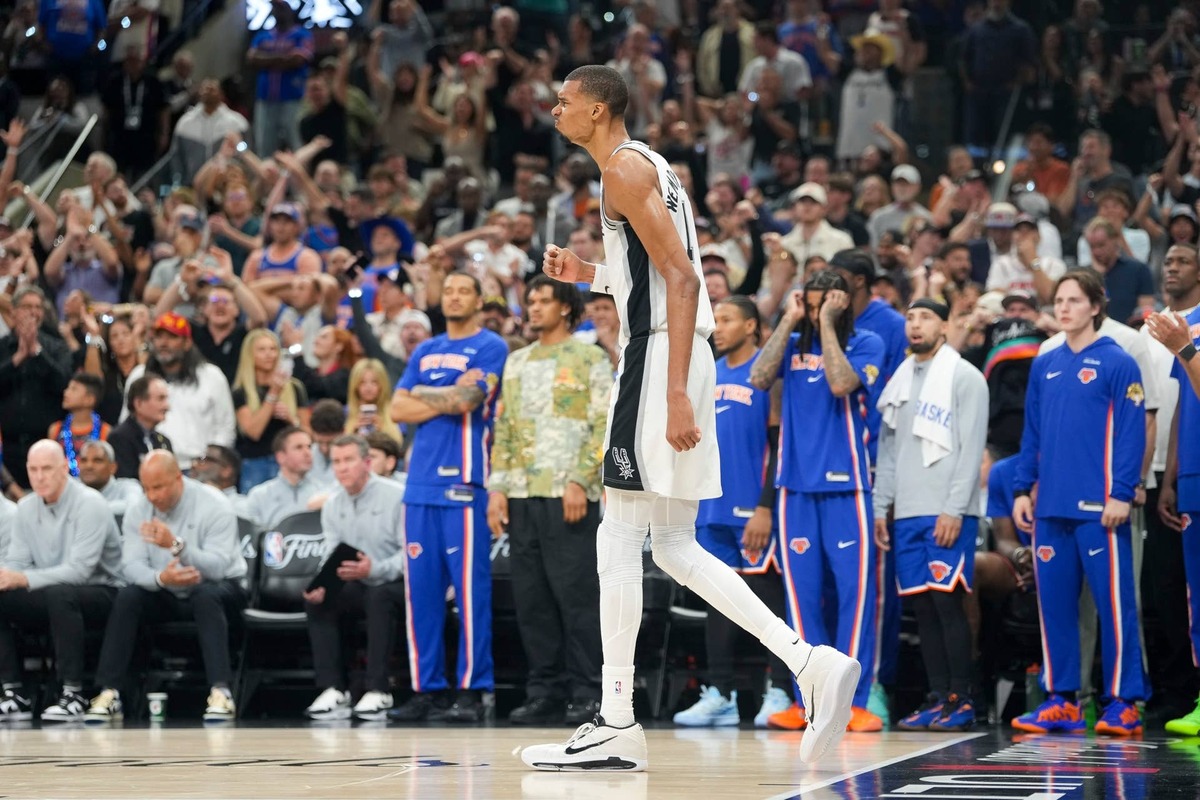  San Antonio Spurs forward Victor Wembanyama (1) celebrates after he dunks the ball against the New York Knicks in the fourth quarter during game two of the 2026 NBA Finals at Frost Bank Center. 