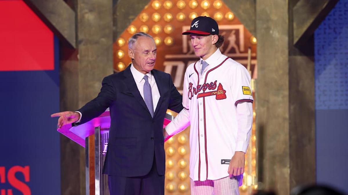  Jul 14, 2024; Ft. Worth, TX, USA; MLB Commissioner Rob Manfred takes a photo with Cam Caminiti after he is drafted by the Atlanta Braves with the 24th pick during the first round of the MLB Draft at Cowtown Coliseum. | Kevin Jairaj-Imagn Images 