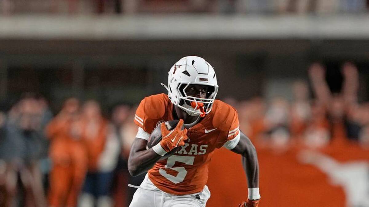  Nov 28, 2025; Austin, Texas, USA; Texas Longhorns running back Quintrevion Wisner (5) runs down the sideline during the first half against the Texas A&M Aggies at Darrell K Royal-Texas Memorial Stadium. Mandatory Credit: Scott Wachter-Imagn Images | IMAGN IMAGES via Reuters Connect 