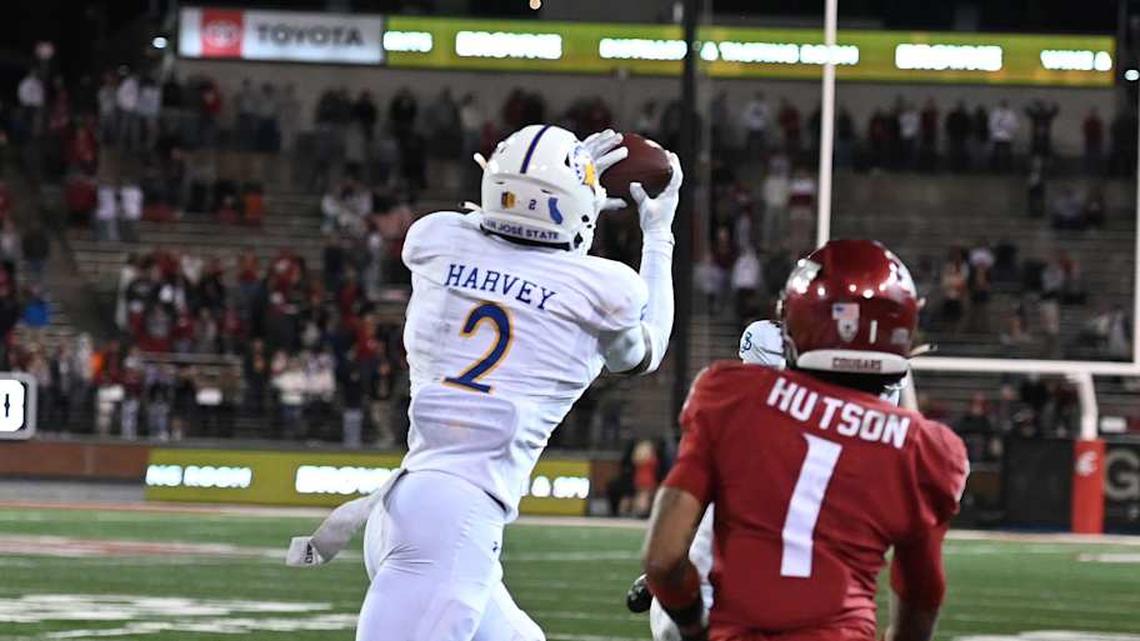  Sep 20, 2024; Pullman, Washington, USA; San Jose State Spartans defensive back DJ Harvey (2) intercepts the ball in front of Washington State Cougars wide receiver Kris Hutson (1) in OT at Gesa Field at Martin Stadium. Washington State Cougars won 54-52 in double overtime. Mandatory Credit: James Snook-Imagn Images | James Snook-Imagn Images 