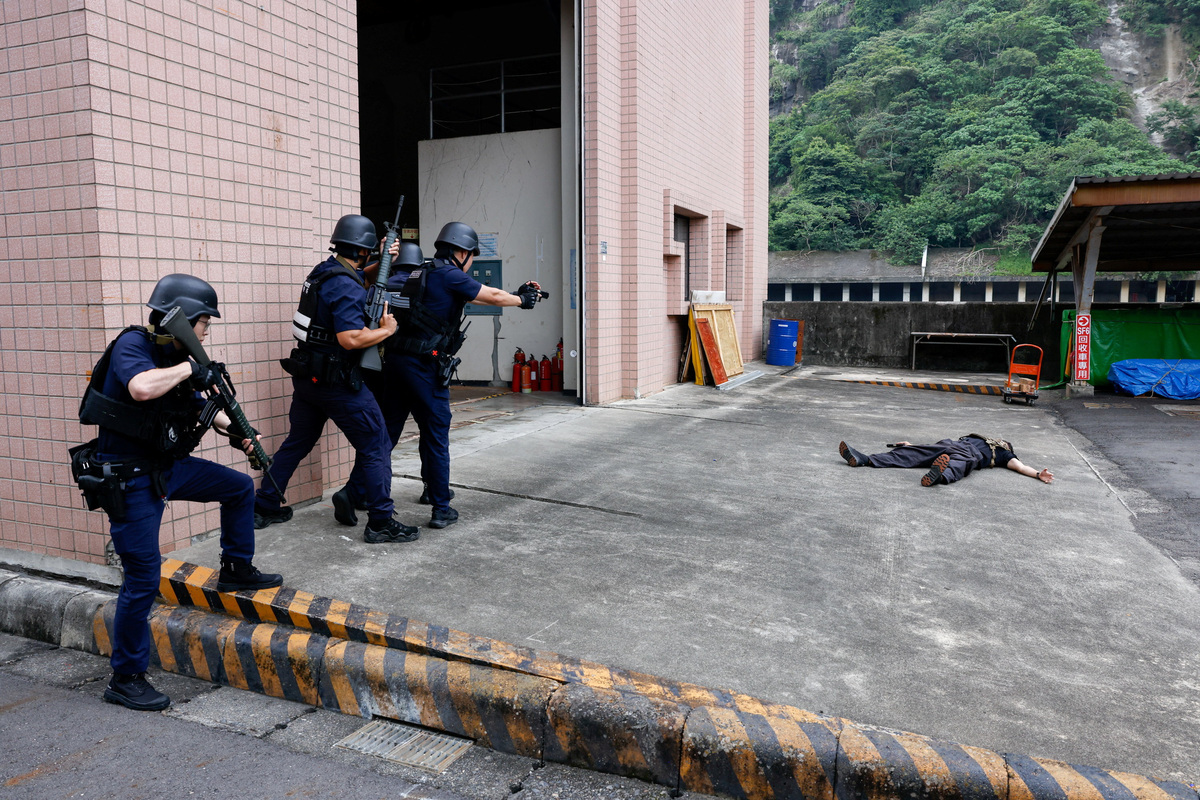 Police officers demonstrate a response to a simulated attack at a critical infrastructure facility during a resilience drill in Nantou, Taiwan, July 2, 2026. REUTERS/Ann Wang