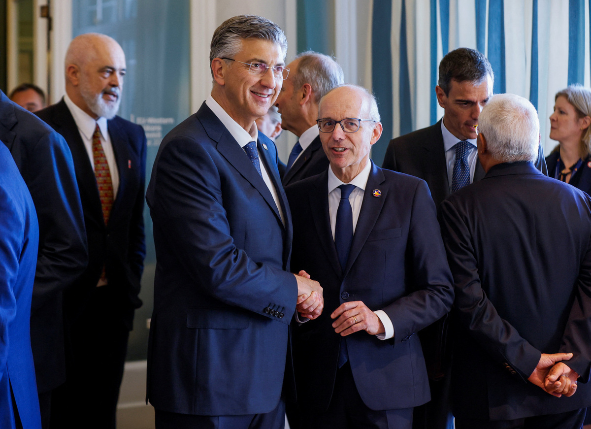 Luxembourg's Prime Minister Luc Frieden and Croatia's Prime Minister Andrej Plenkovic shake hands as they arrive for a plenary session at the EU-Western Balkans Summit in Tivat, Montenegro, June 5, 2026. REUTERS/Stevo Vasiljevic