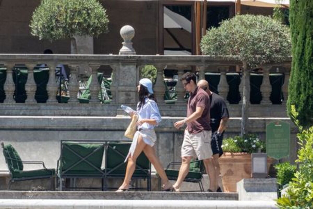 Dua Lipa and Callum Turner walk near the restaurant at Grand Hotel Villa Igiea, where the first guests are gathering ahead of the couple's wedding celebrations, in Palermo, Italy, June 4, 2026. REUTERS/Igor Petyx