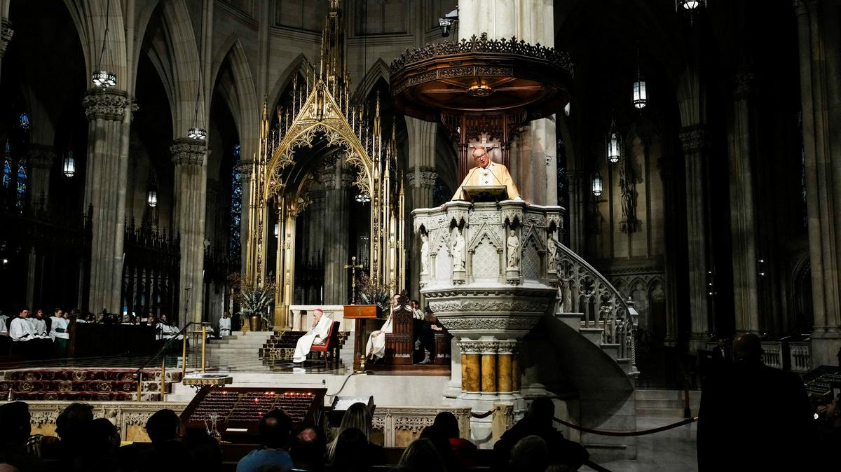 FILE PHOTO: New York Archbishop Timothy Dolan attends the mass before blessing food donations prepared by Catholic Charities for families in need ahead of Thanksgiving week, outside St. Patrick’s Cathedral in New York City, U.S., November 23, 2025. REUTERS/Eduardo Munoz./File Photo