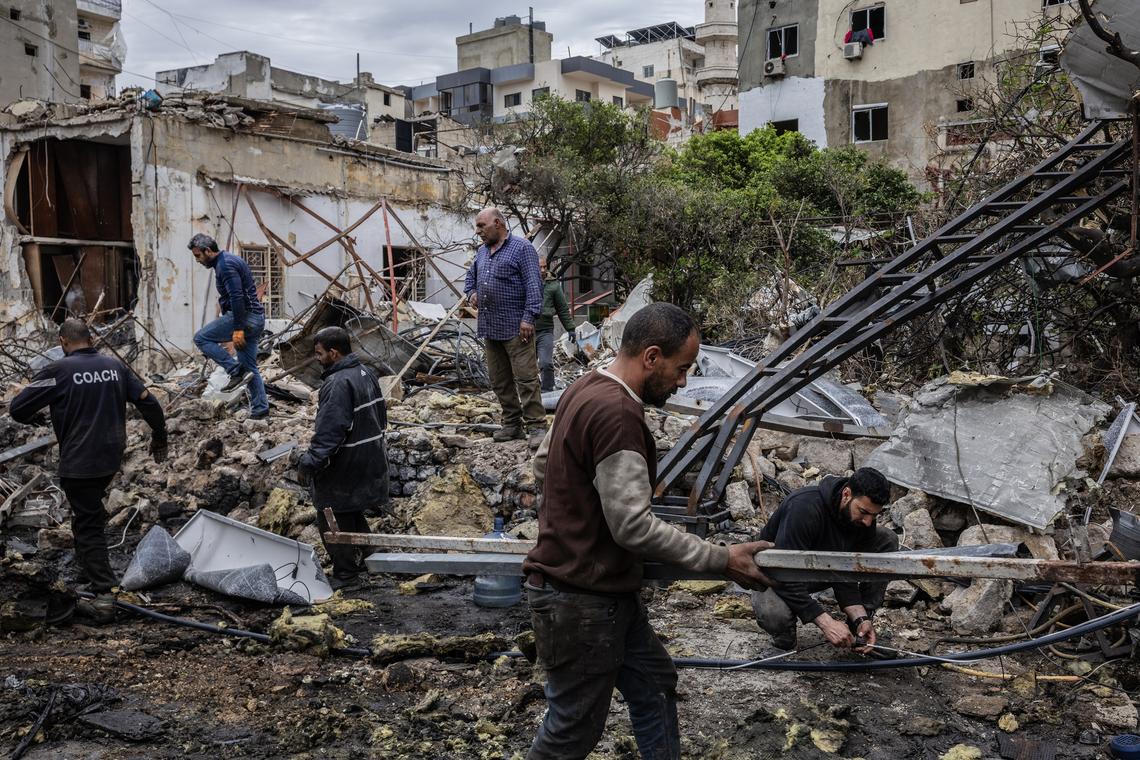 FILE -- Residents collect scrap metal from a power station destroyed by Israeli airstrikes on Tyre, Lebanon, April 1, 2026. Israel is considering a short-term cease-fire in Lebanon that could pause the war against Iran-backed Hezbollah, three Israeli officials said on Wednesday, April 15. (David Guttenfelder/The New York Times)