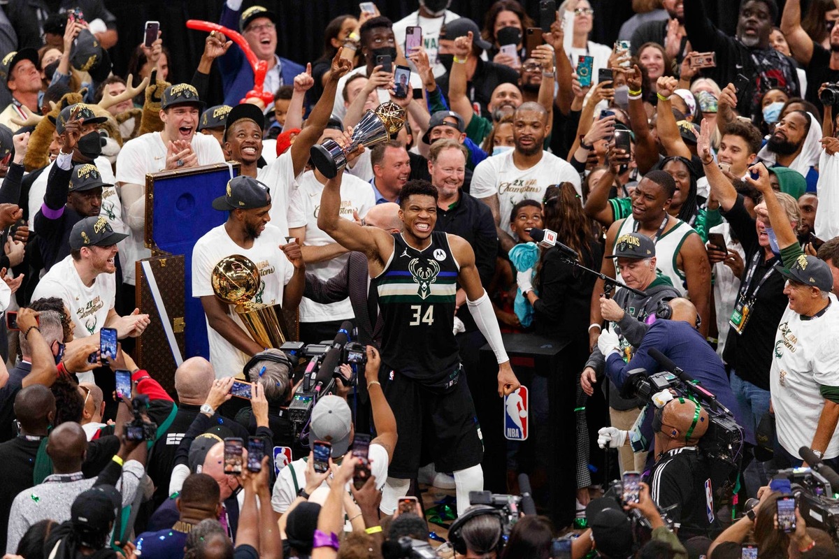  Milwaukee Bucks forward Giannis Antetokounmpo celebrates with the NBA Finals MVP Trophy after winning the 2021 NBA Finals. Jeff Hanisch-USA TODAY Sports