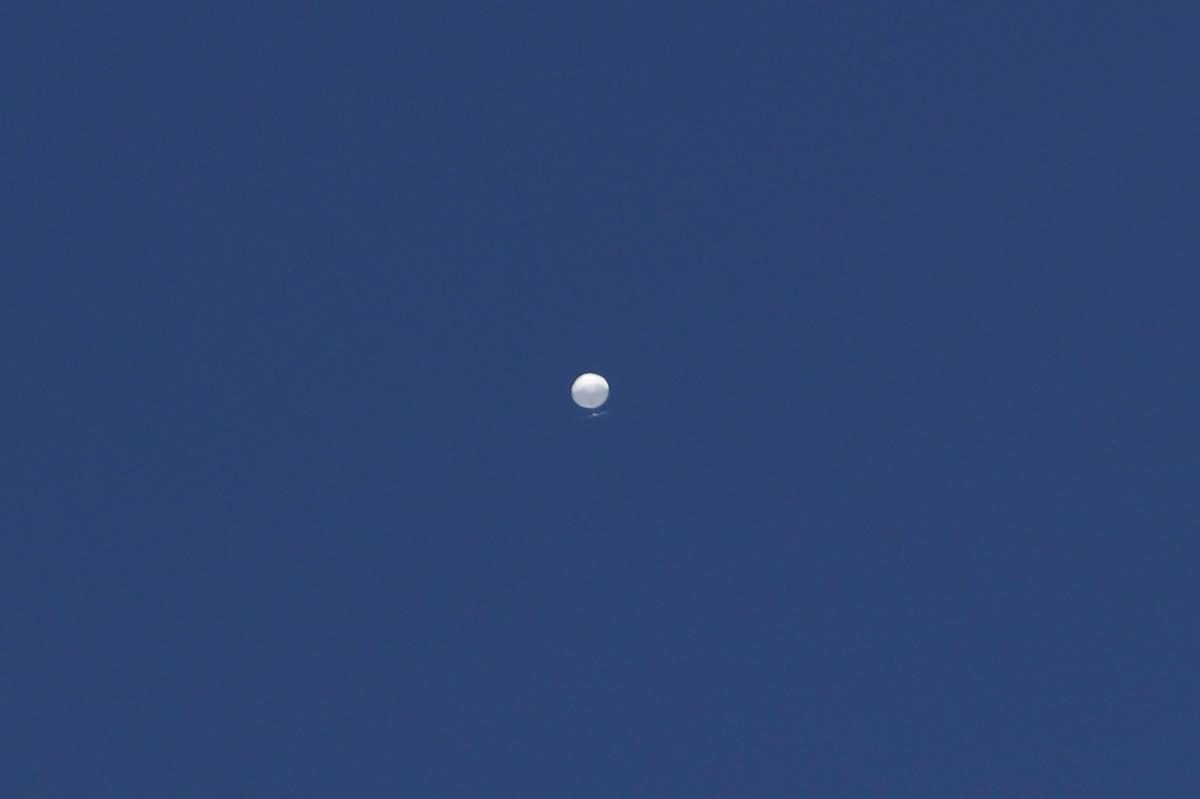 A balloon floats over Columbia, Mo., on Friday, Feb. 3, 2023. A huge, high-altitude Chinese balloon sailed across the U.S. on Friday, drawing severe Pentagon accusations of spying despite China’s firm denials.