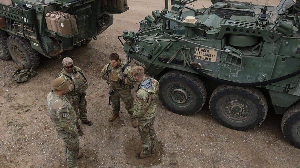 Soldiers of the U.S. Army 2nd Cavalry Regiment Stryker Brigade, which is based in Vilseck, Germany, prepare to head out with their vehicles during the Saber Strike 26 NATO military exercises on May 7, 2026, near Bemowo Piskie, Poland.