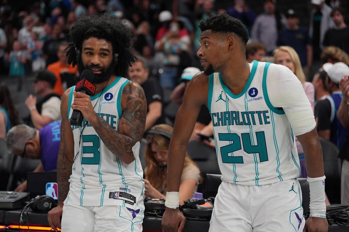  Charlotte Hornets guard Coby White (3) alongside forward Brandon Miller (24) give an interview after the overtime win. Jim Dedmon-Imagn Images