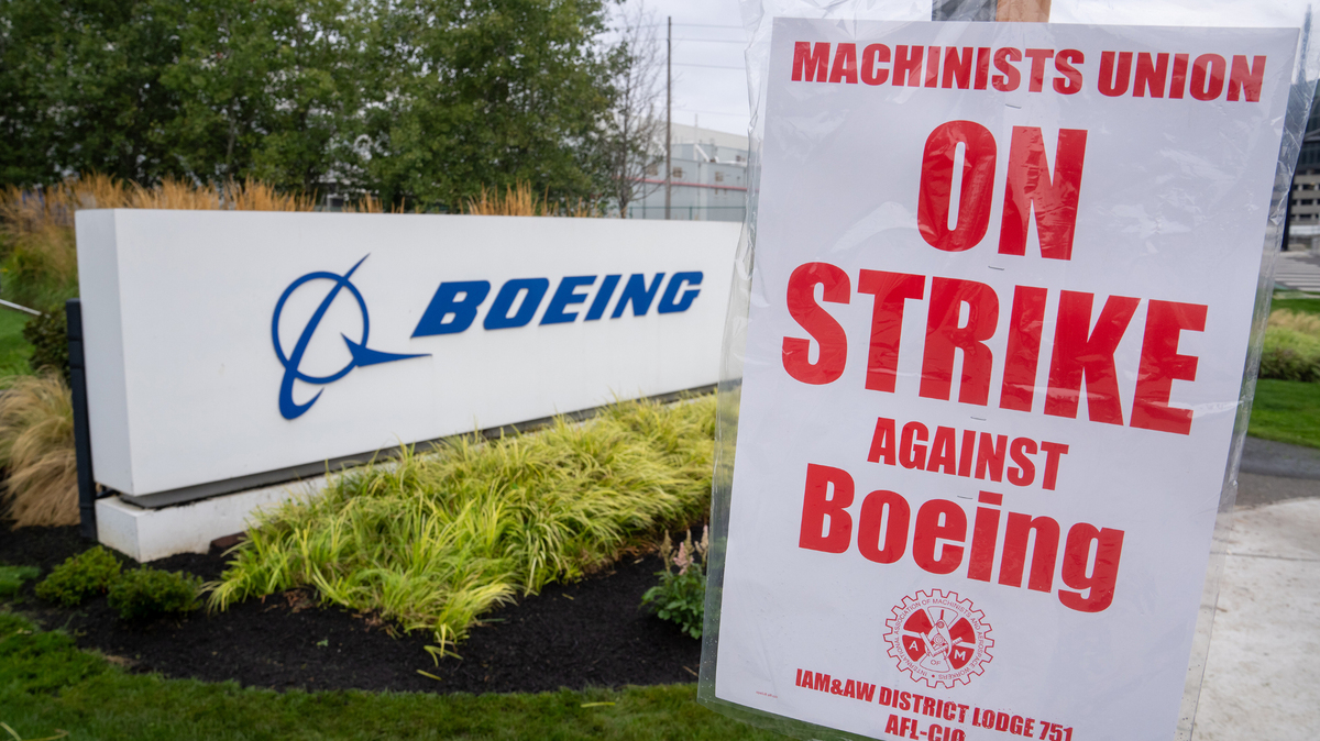 A strike sign is pictured outside a Boeing factory on Sept. 13 in Renton, Washington. ]