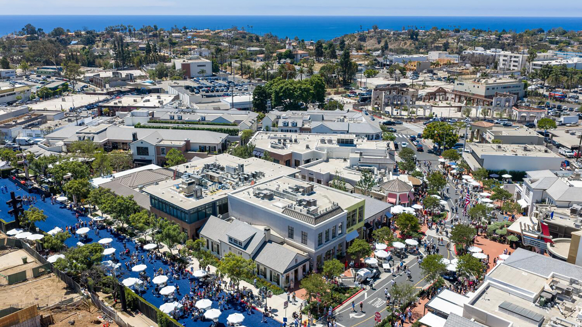 Palisades Village shopping center reopens, marking milestone for fire-weary community 