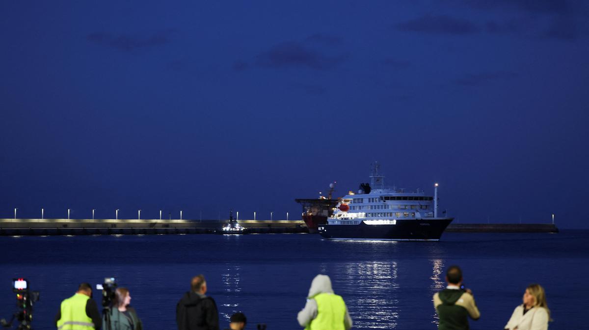 Members of the media work at the port of Granadilla de Abona following the arrival of the cruise ship MV Hondius, affected by a hantavirus outbreak, in Tenerife, Spain, May 11, 2026. REUTERS/Hannah McKay