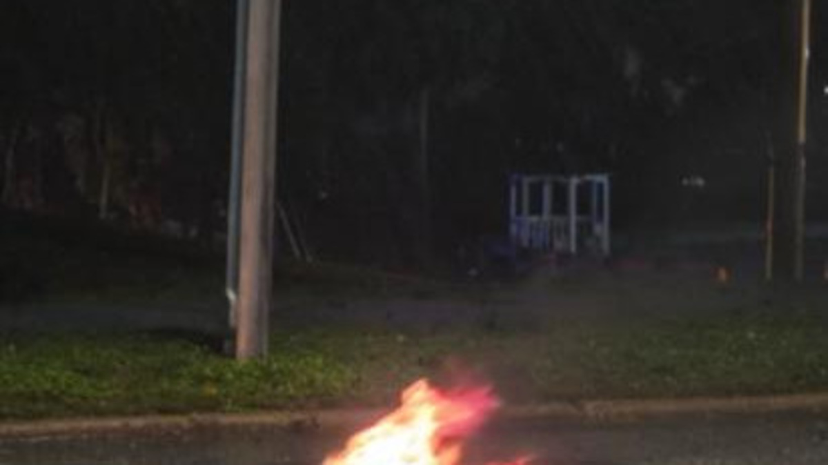 Photo shows street damage and fire coming out of manhole in downtown Tallahassee, early on Oct. 6, 2026