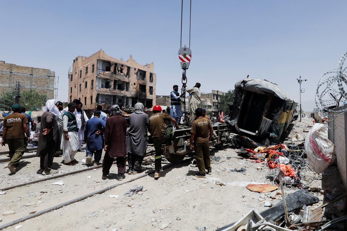 Railway staff and Provincial Disaster Management Authority (PDMA) personnel work at the site, after a blast near a railway track in Quetta, Pakistan, May 24, 2026. REUTERS/Naseer Ahmed