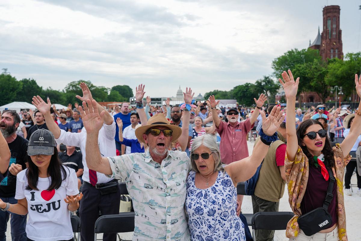 Attendees participate in Rededicate 250: National Jubilee of Prayer, Praise & Thanksgiving on the National Mall in Washington, D.C., U.S., May 17, 2026. REUTERS/Eric Lee