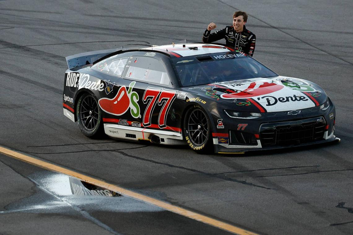 Carson Hocevar celebrates by driving down the grandstands and hanging out of the window of his car at Talladega. (Photo by Sean Gardner/Getty Images)