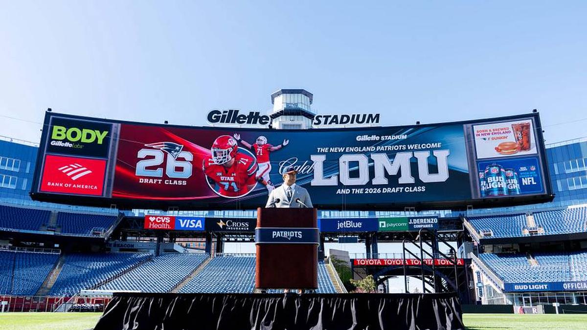  May 7, 2026; Foxborough, MA, USA; New England Patriots first round draft pick Caleb Lomu addresses the media during a press conference on the game field at Gillette Stadium. Mandatory Credit: Natalie Reid-Imagn Images | Natalie Reid-Imagn Images 