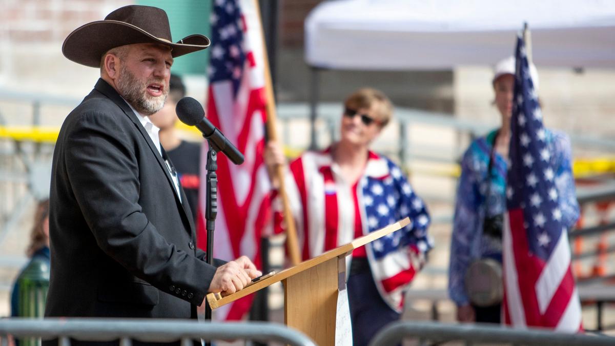 Ammon Bundy speaks to a crowd of about 50 followers in front of the Ada County Courthouse in downtown Boise in April. The Emmett resident faces trial Jan. 13 on a misdemeanor charge of trespassing after being ordered to stay away from the Idaho Statehouse.