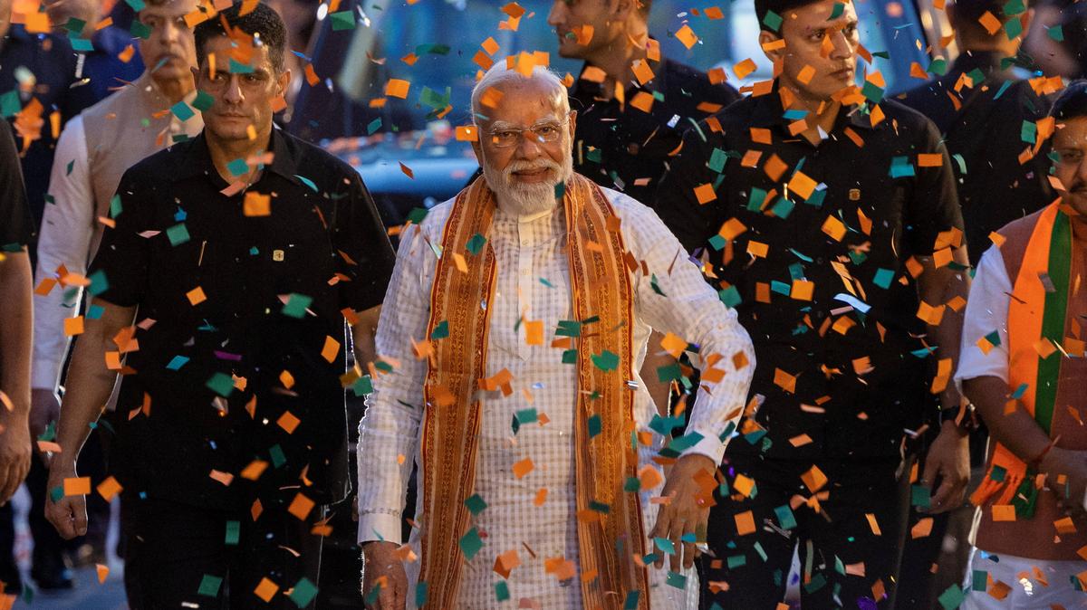 India's Prime Minister Narendra Modi greets his supporters as he arrives at the Bharatiya Janata Party (BJP) headquarters as BJP celebrates its win in the West Bengal and Assam states' assembly elections, in New Delhi, India, May 4, 2026. REUTERS/Adnan Abidi