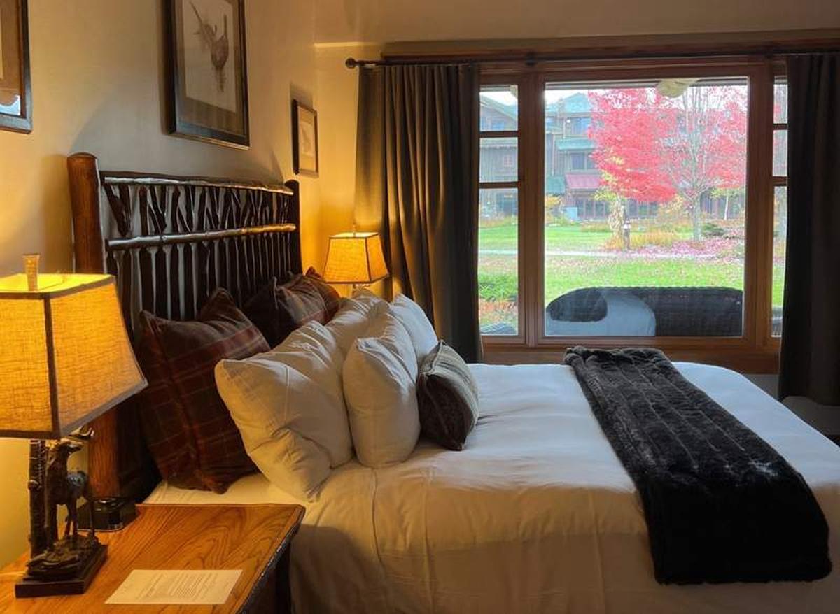  The Whiteface Lodge suites have all the comforts of home, including plush bedding and foliage views. Photo credit: Alexa Mellardo. 