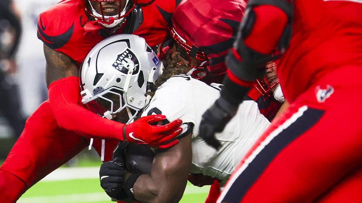  Dec 21, 2025; Houston, Texas, USA; Houston Texans safety Calen Bullock (2) tackles Las Vegas Raiders running back Ashton Jeanty (2) during the third quarter at NRG Stadium. Mandatory Credit: Thomas Shea-Imagn Images | Thomas Shea-Imagn Images 
