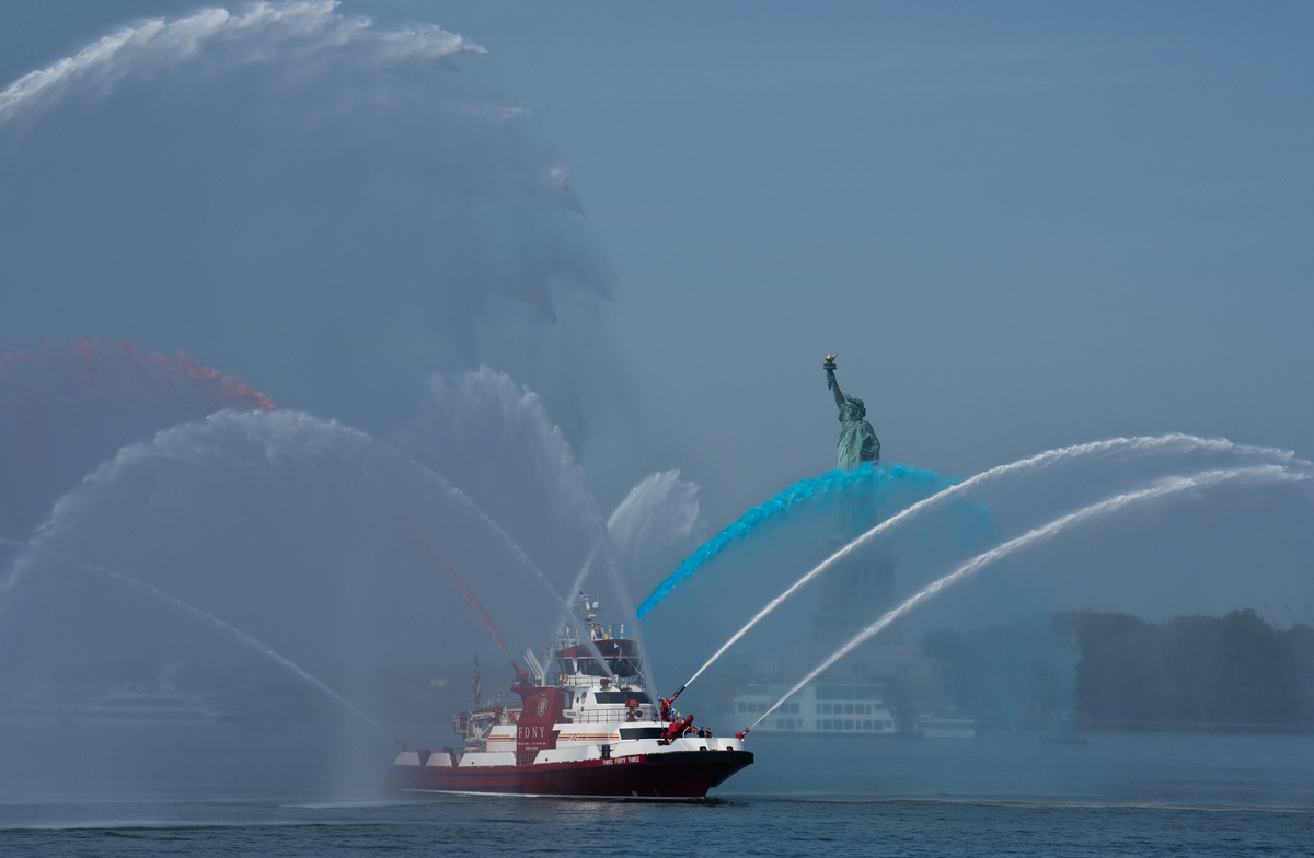 The Statue of Liberty stands tall above New York for the boat parade July 4, 2026. America celebrates the 250th anniversary of its independence today, with people from one end of the country to the other marking the milestone with fireworks, parades and concerts. (Juan Arredondo/The New York Times)