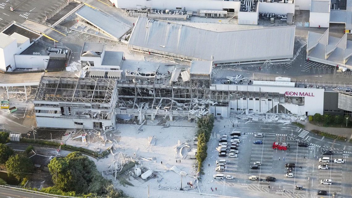 Japan quake toll rises to at least 13 as rescuers haul people from collapsed mall