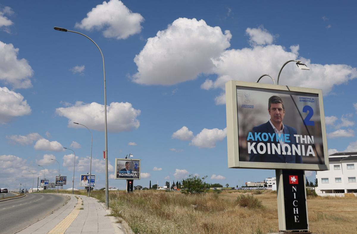 Election campaign billboards of candidates for Cyprus parliamentary election, to be held on May 24, are placed on a street in Nicosia, Cyprus May 6, 2026. REUTERS/Yiannis Kourtoglou