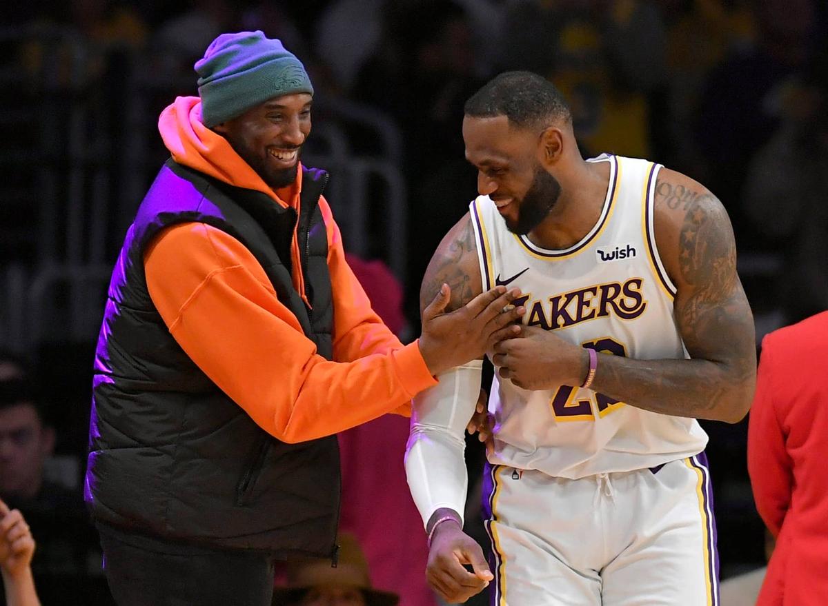  LOS ANGELES, CA - DECEMBER 29: LeBron James #23 of the Los Angeles Lakers has a moment on the sideline with former Laker Kobe Bryant in the second half during a game against the Dallas Mavericks at Staples Center on December 29, 2019 in Los Angeles, California. (Photo by John McCoy/Getty Images) 
