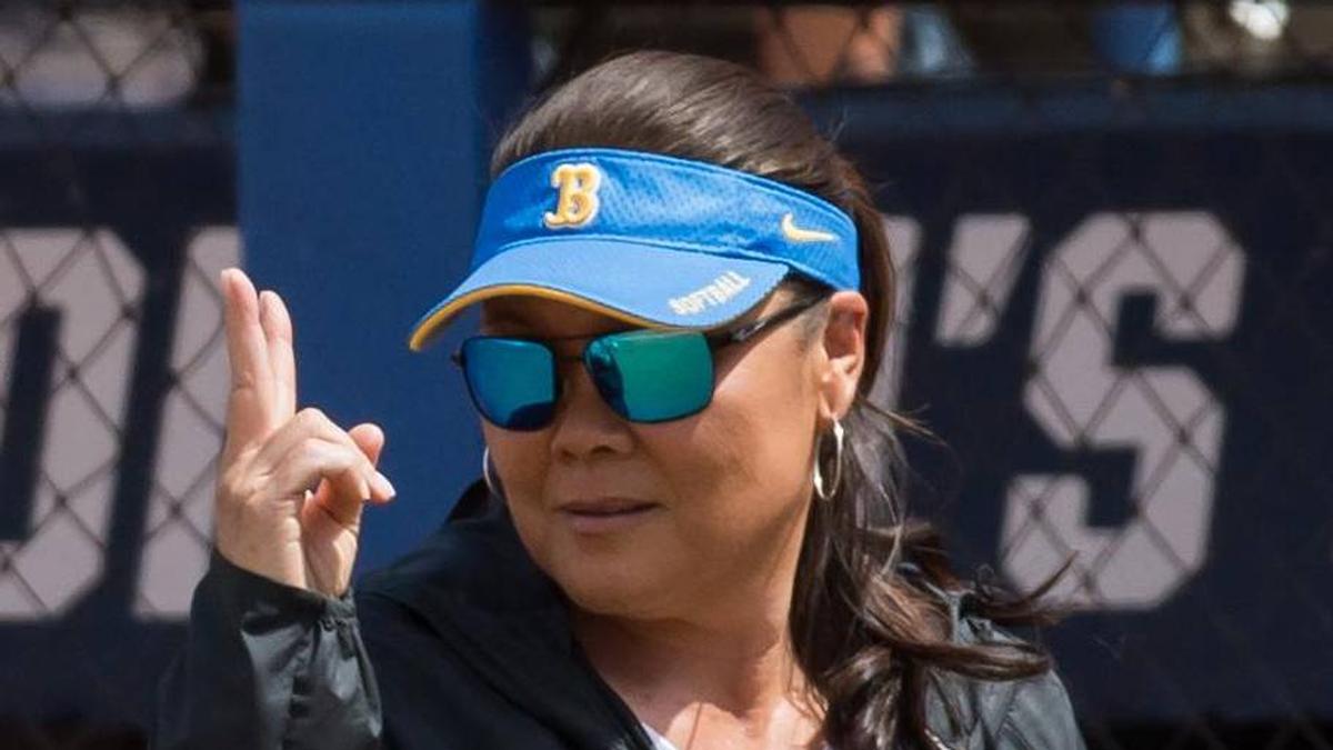  Jun 1, 2024; Oklahoma City, OK, USA; UCLA Bruins head coach Kelly Inouye-Perez signals to her players as they come off the field in the fourth inning against the Oklahoma Sooners during a Women's College World Series softball winners bracket game at Devon Park. Mandatory Credit: Brett Rojo-Imagn Images | Brett Rojo-Imagn Images 