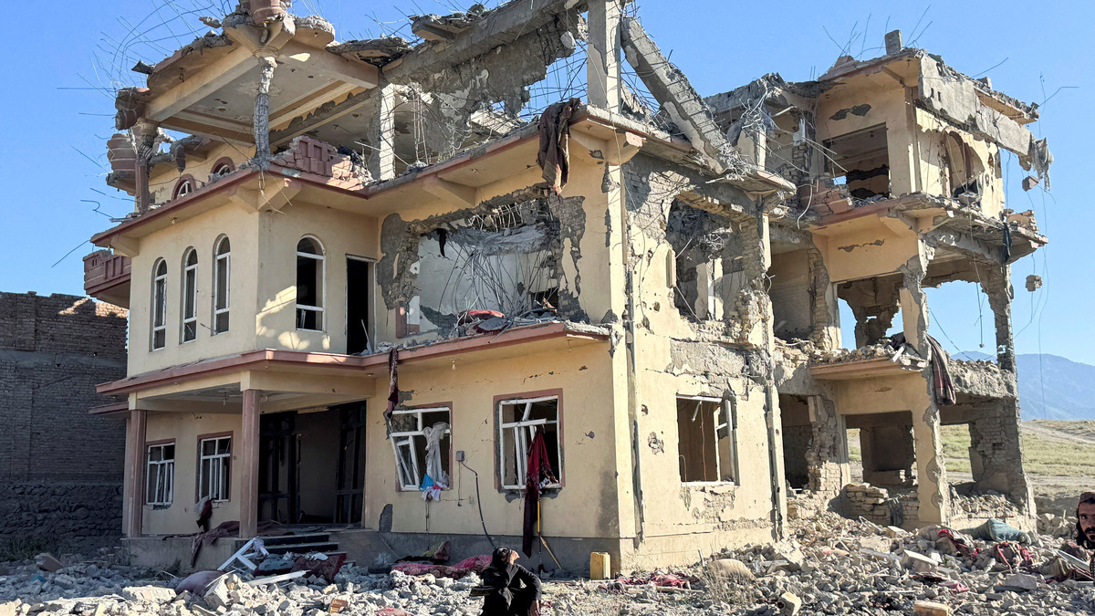 A man sits in front of a destroyed building after an attack, which the Taliban say was an airstrike carried out by Pakistan's security forces, in Samkani District, Paktia Province, Afghanistan, June 29, 2026. REUTERS/Stringer