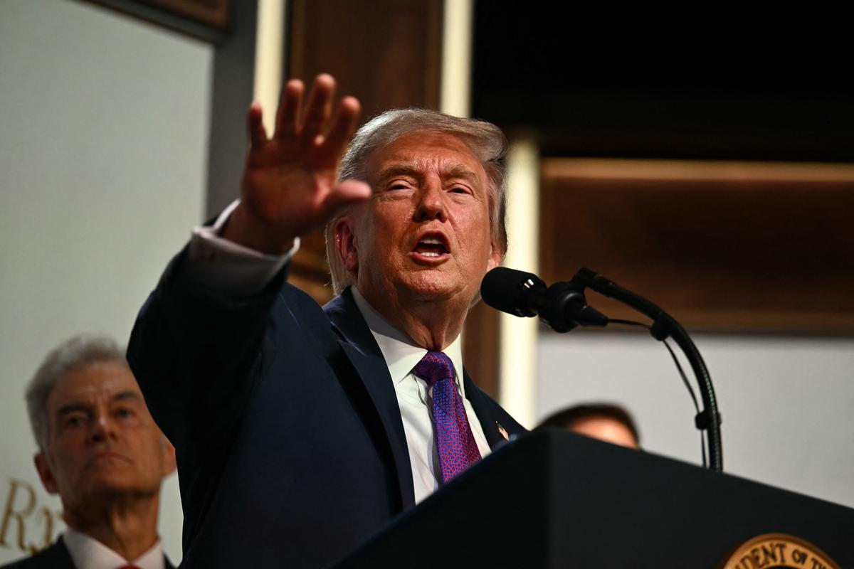  US President Donald Trump takes questions from the press during a healthcare affordability event in the South Court Auditorium of The White House in Washington, DC, on May 18, 2026. 