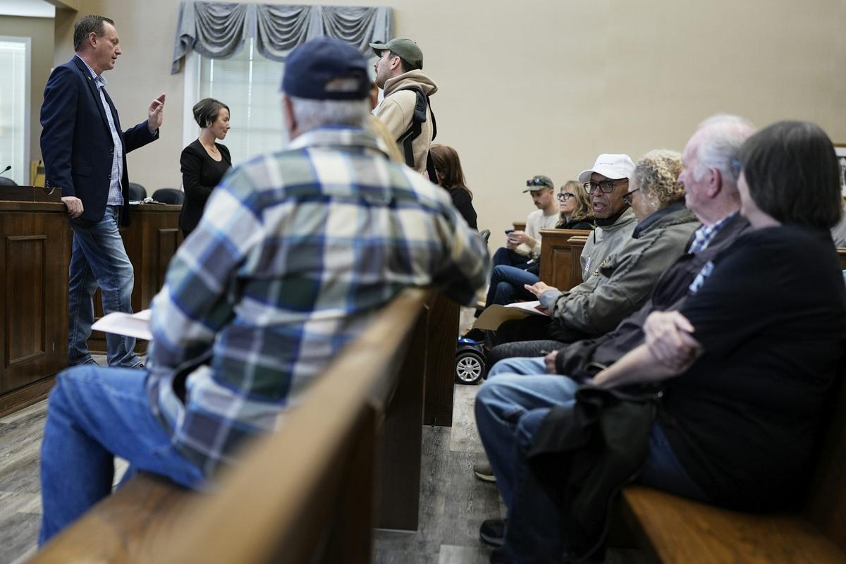  Ray Render, left, a staffer for Rep. John Rose, meets with constituents in Gallatin, Tenn., about their concerns related to changes to Social Security Administration practices in March 2025. AP Photo/George Walker IV 