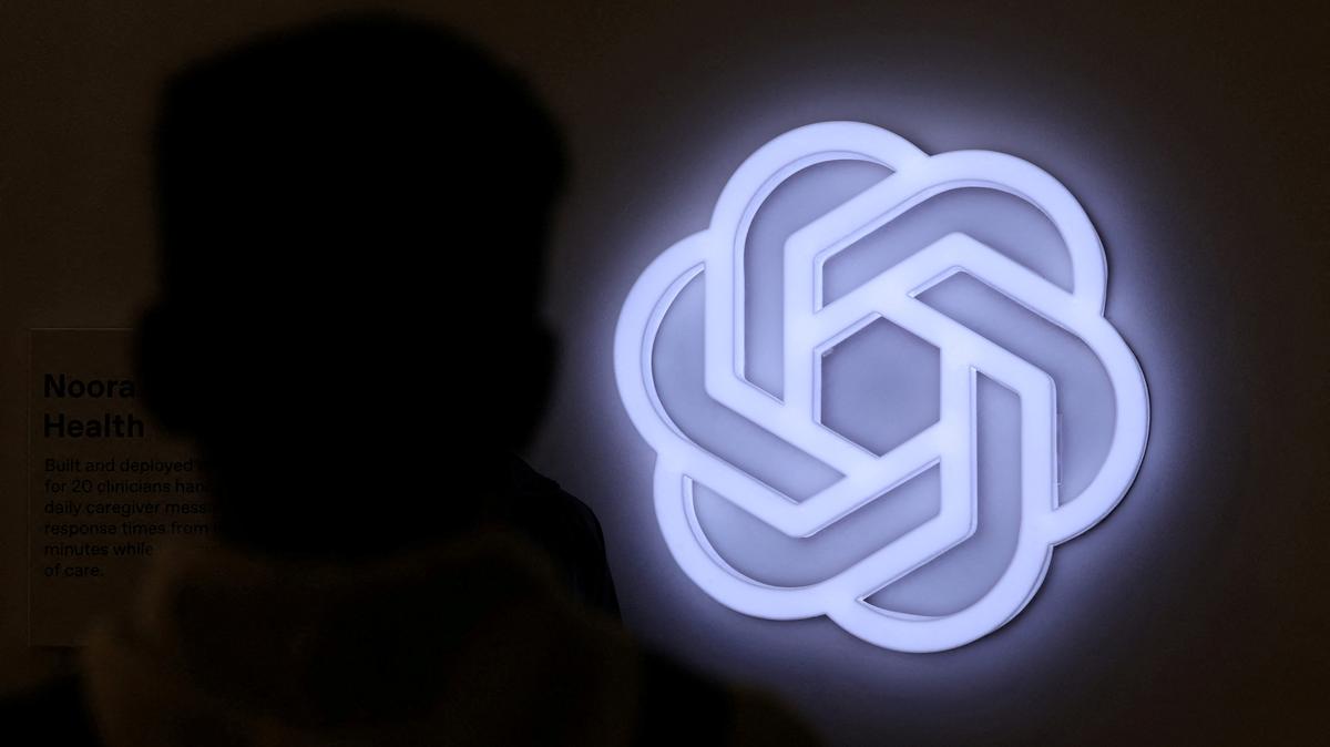 FILE PHOTO: A person stands next to the logo of ChatGPT, an AI-powered chatbot by OpenAI at Bharat Mandapam, one of the venues for AI Impact Summit, in New Delhi, India, February 17, 2026. REUTERS/Bhawika Chhabra/File Photo