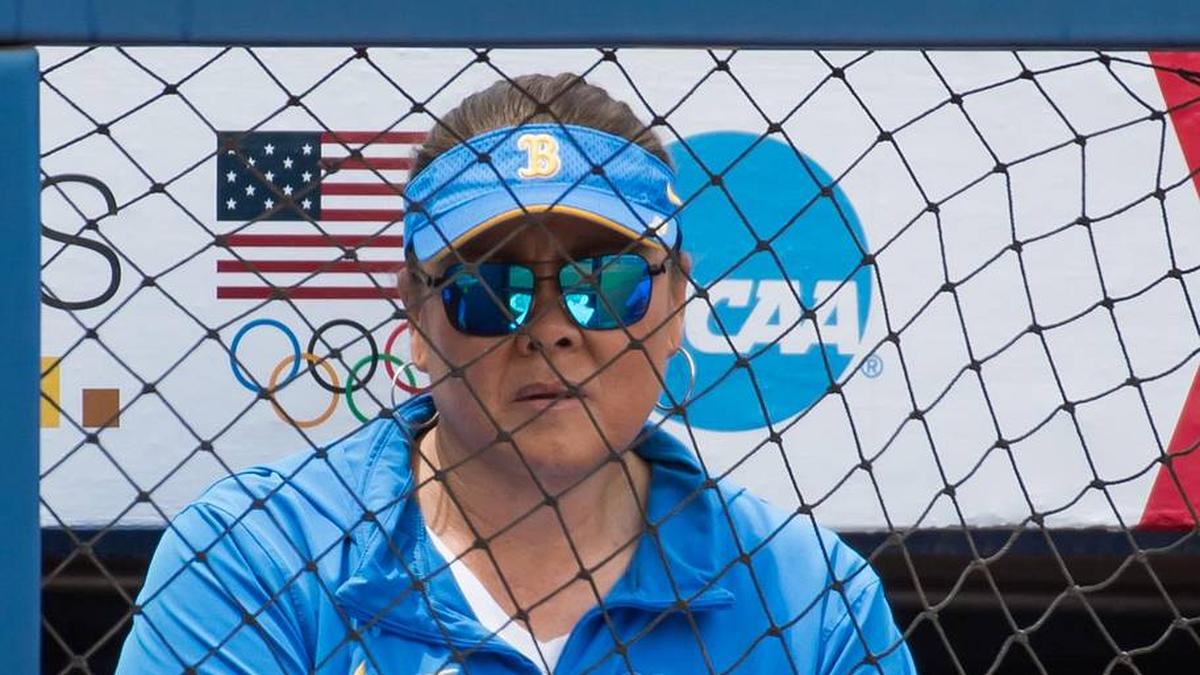  May 30, 2024; Oklahoma City, OK, USA; UCLA Bruins head coach Kelly Inouye-Perez looks on from the dugout in the fifth inning against the Alabama Crimson Tide during a Women's College World Series softball game at Devon Park. Mandatory Credit: Brett Rojo-Imagn Images | Brett Rojo-Imagn Images 